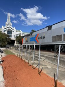 Amtrak passenger rail train by groundbreaking ceremony shovels