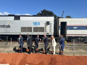 Groundbreaking ceremony in front of Amtrak passenger train